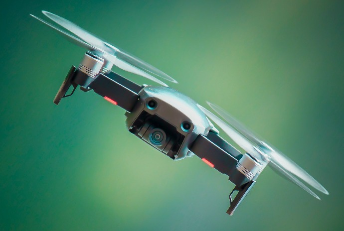 selective focus photography of gray and black quadcopter drone